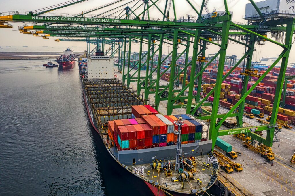 blue and red cargo ship on dock